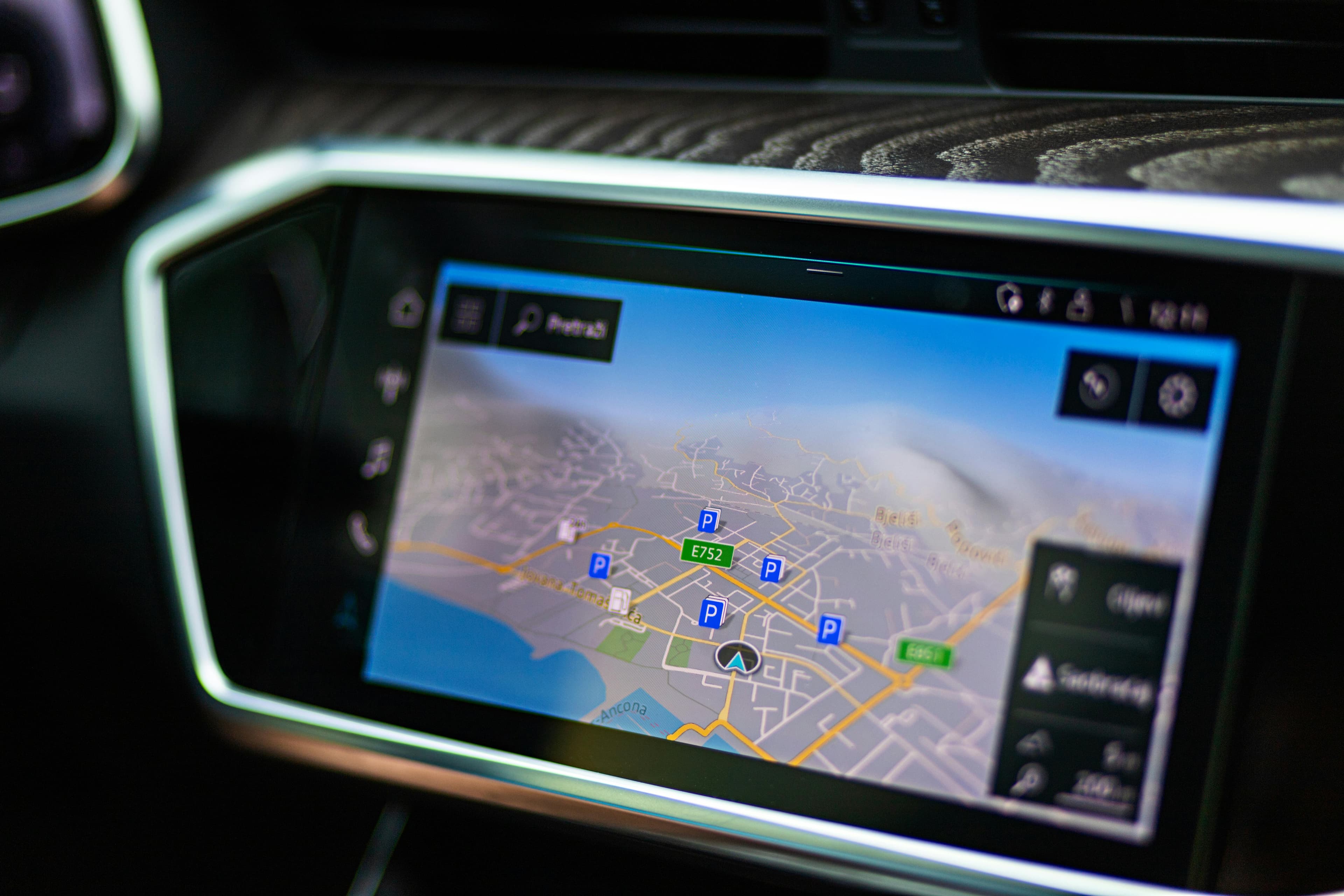 Close-up of a digital navigation display inside a car.