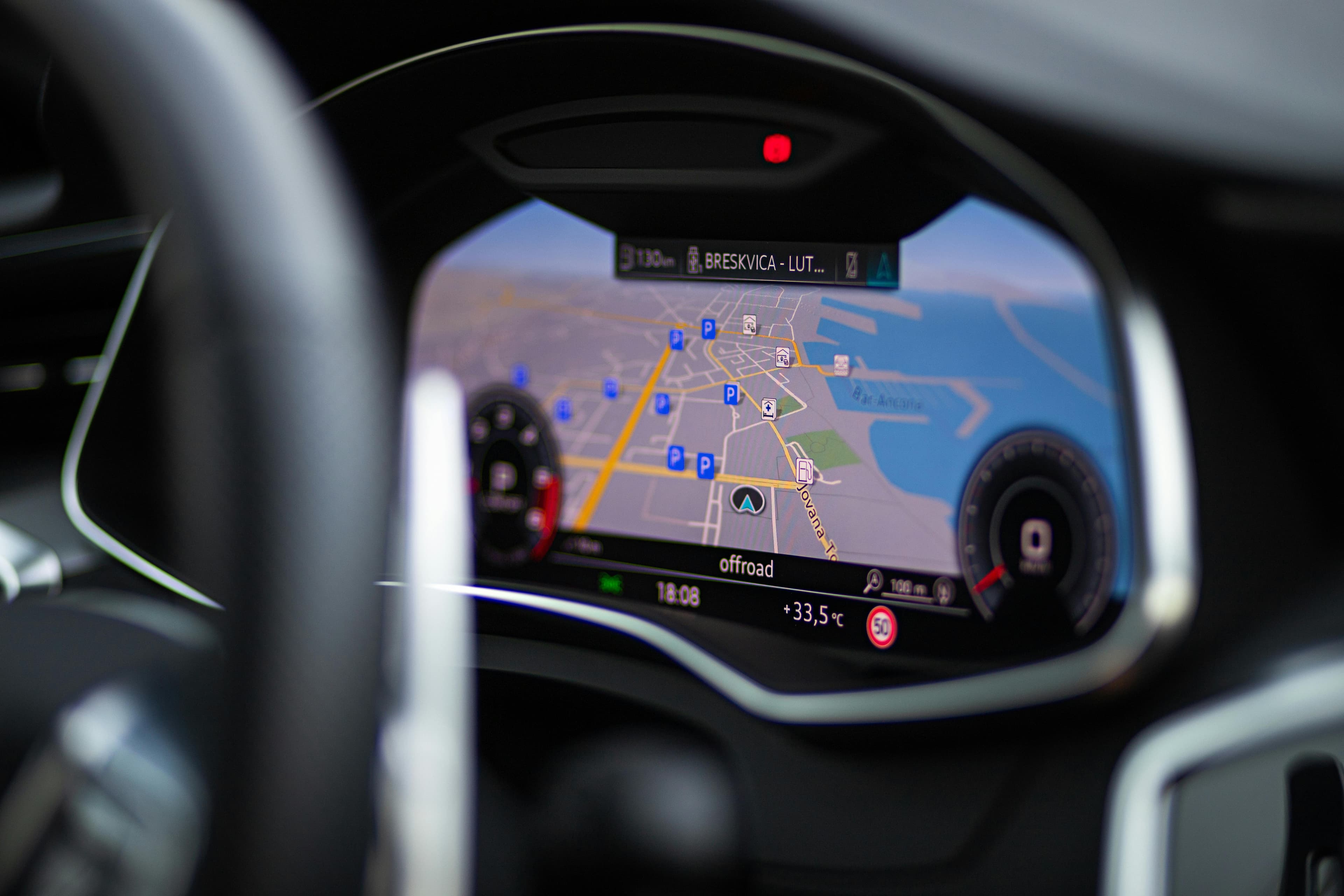 Car navigation screen showing a digital city map.